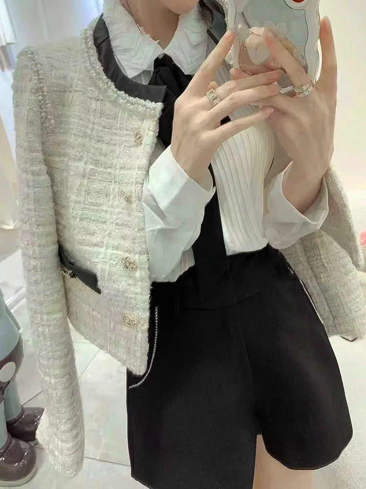 Blazer de tweed de lujo con recipiente de cuero